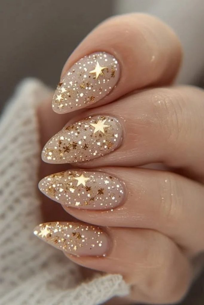 Champagne Starry Night Nails with Golden Stars.