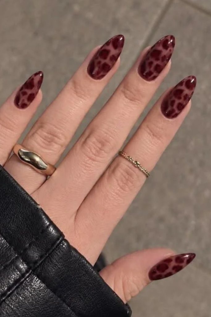 Cherry mocha leopard print nail design.