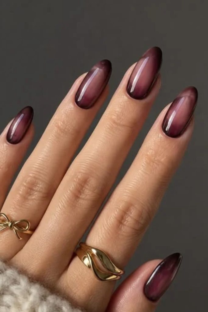 Cherry mocha aura gradient nail design.