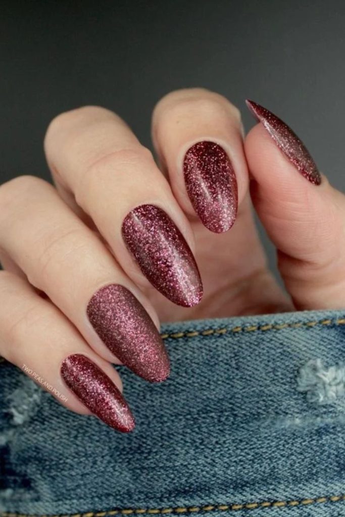 Glittery cherry mocha glamorous nail design.