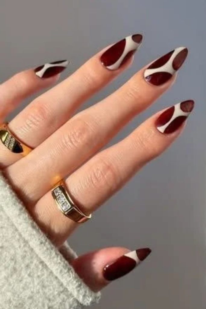 Cherry mocha negative space nail art.