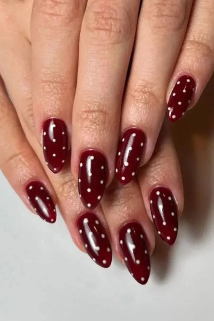 Cherry mocha nails with polka dots.