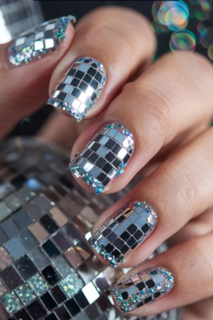 Classic silver disco ball nails with shimmering mirror tiles.