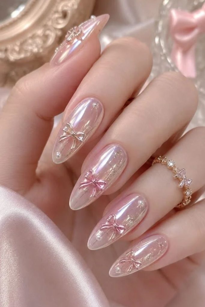 Pearl chrome coquette nails with iridescent shine.