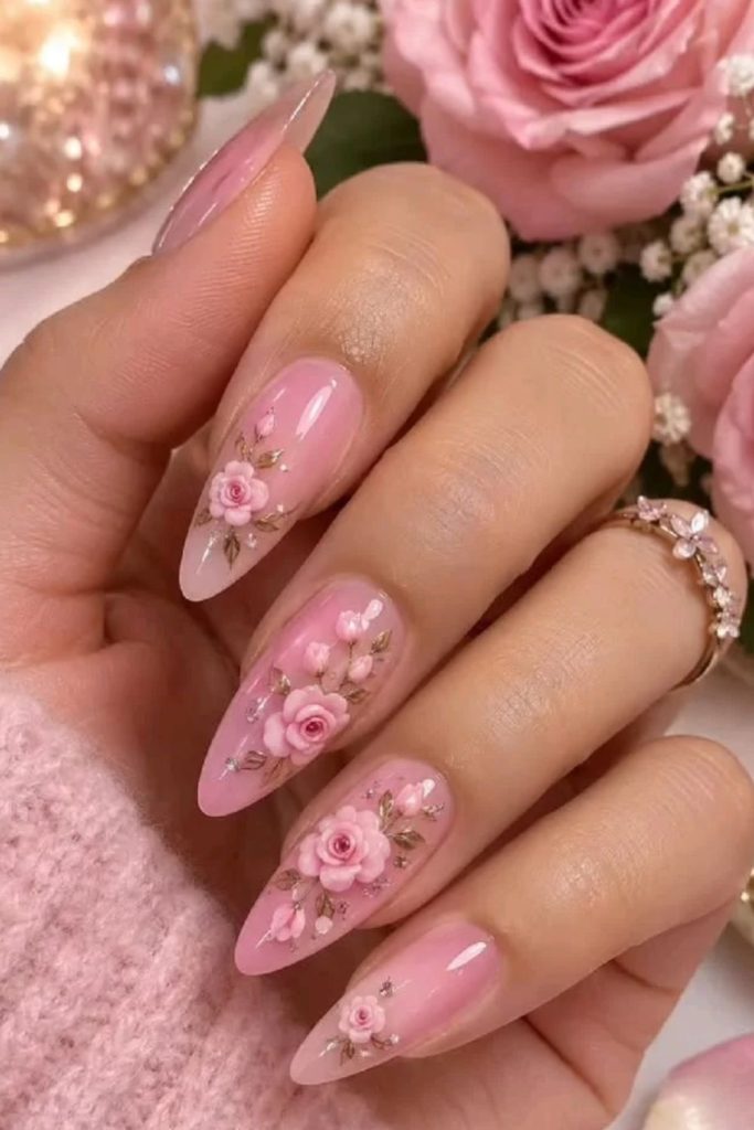 Floral coquette nails with delicate painted blossoms.