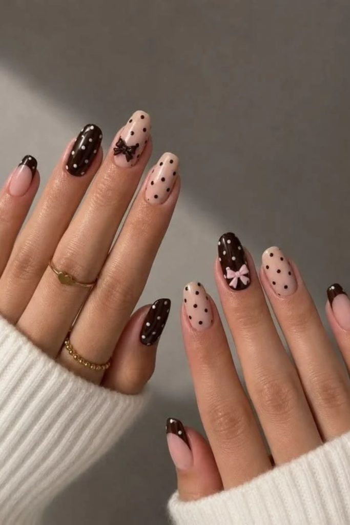 Polka dot coquette nails with dainty bows.