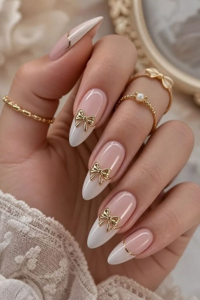 Velvet coquette nails with shimmering pink ribbons.