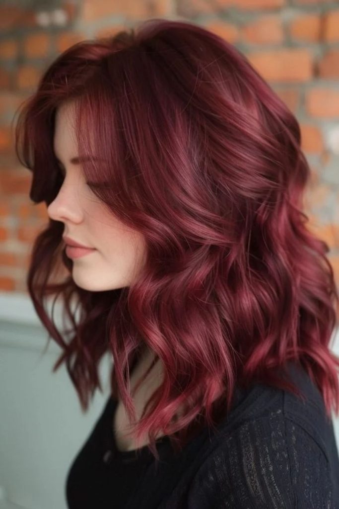 Cranberry wine hair with dimensional highlights.