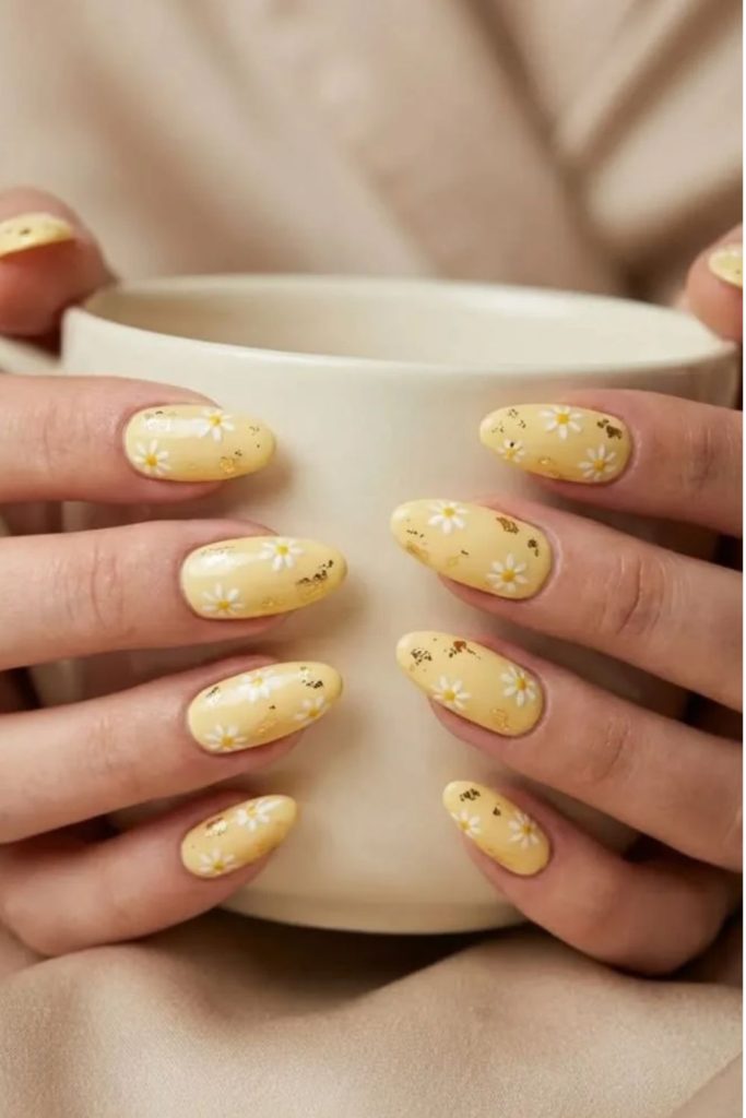 Butter yellow daisy floral nail design.
