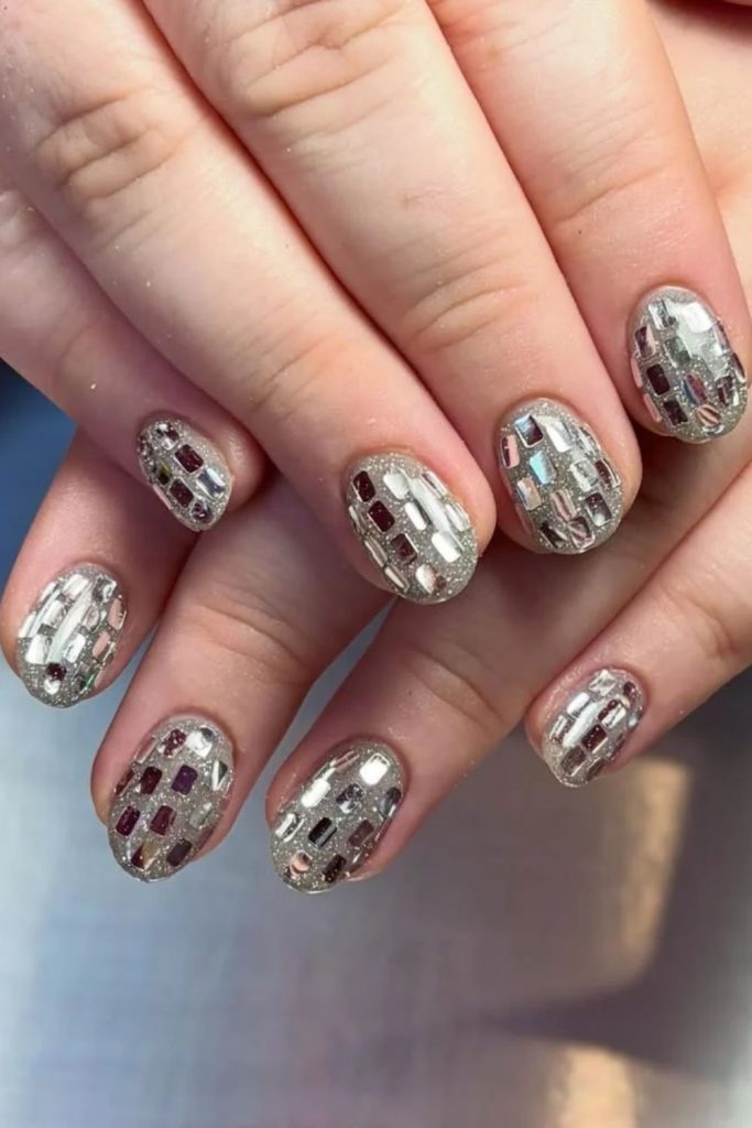 Aura disco nails with dreamy holographic details.