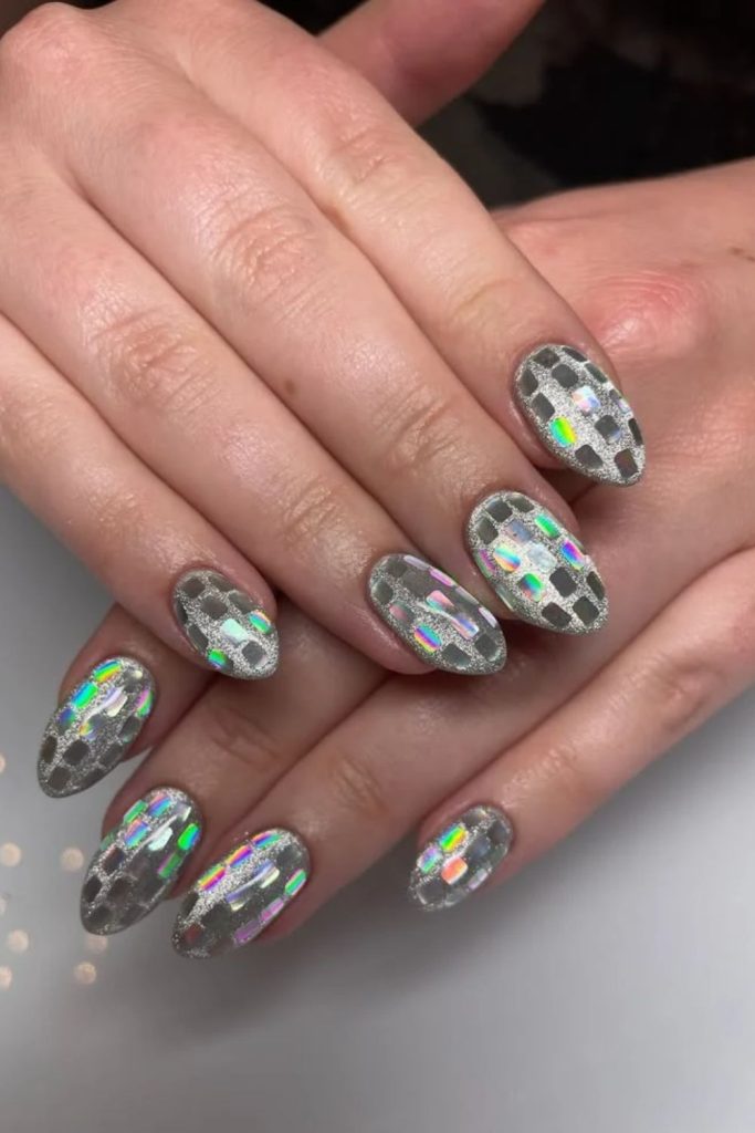 Cat eye disco nails with magnetic silver shimmer.