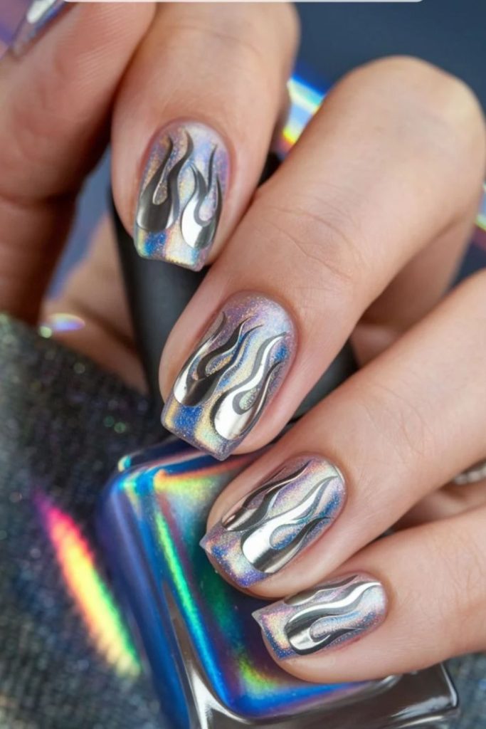 Disco flame nails with fiery metallic details.