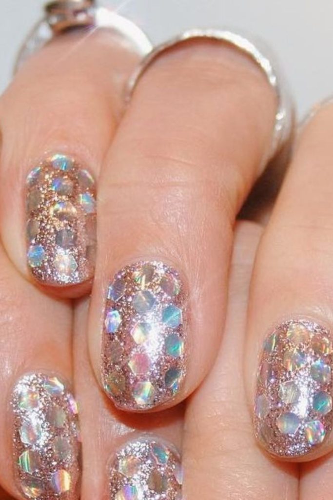 Glitter bomb disco nails with dazzling holographic flakes.