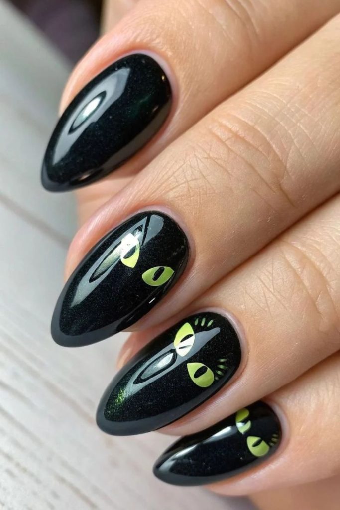 Emerald-eyed black feline nail art