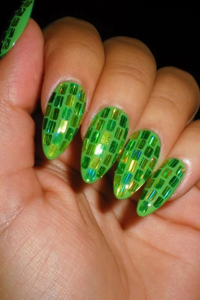 Green disco nails with reflective silver mosaics.
