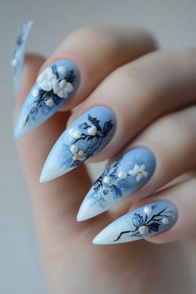 Icy blue nails with snowy poinsettia flowers.