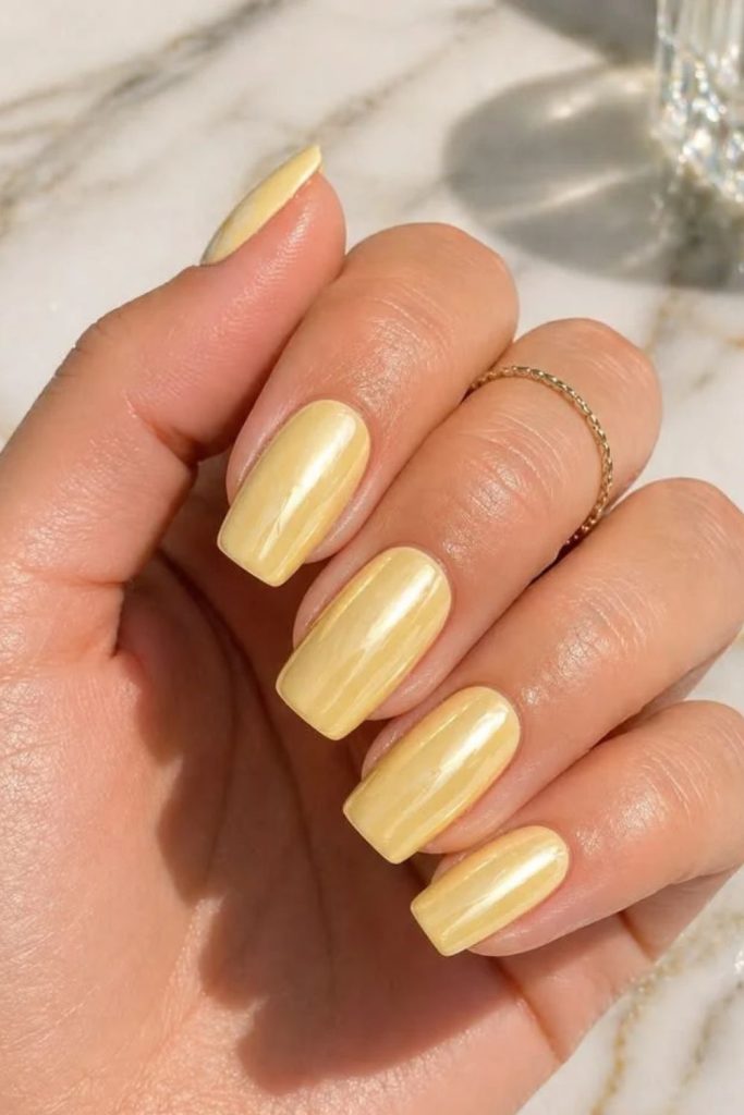 Lemon meringue creamy yellow glossy nails.