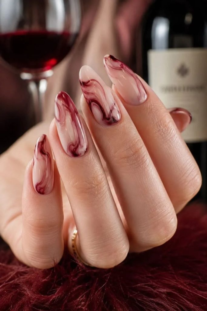 Milky mocha nails with cherry swirls.
