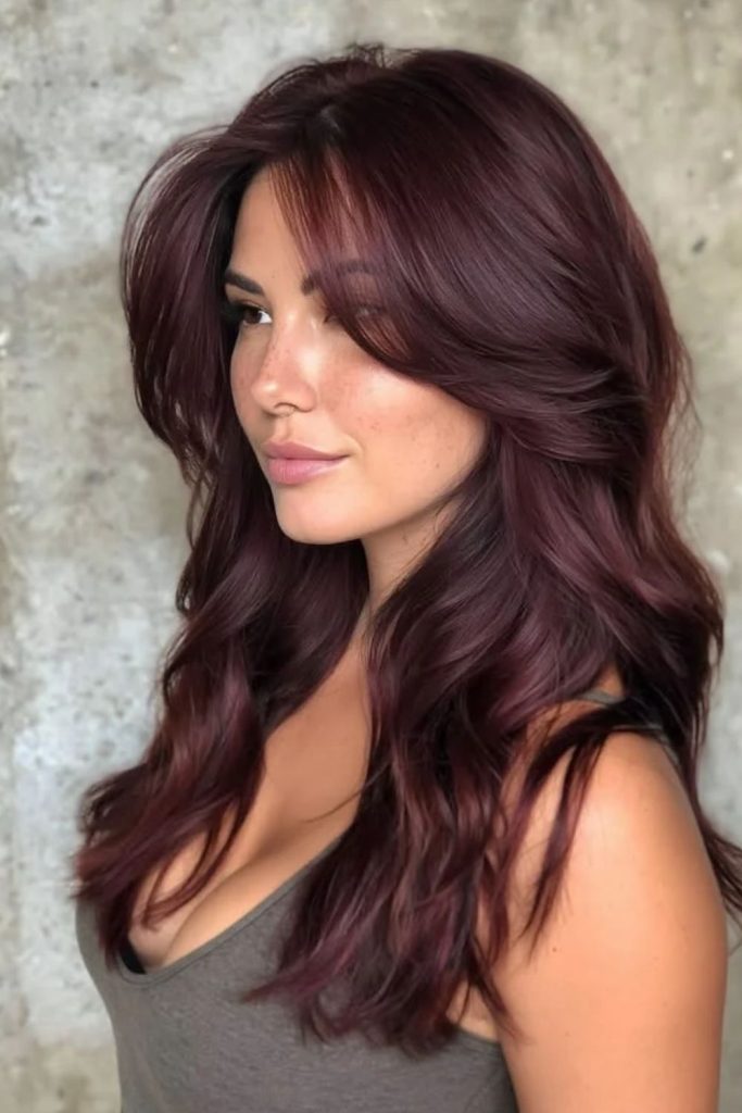 Mulled wine balayage with soft waves.