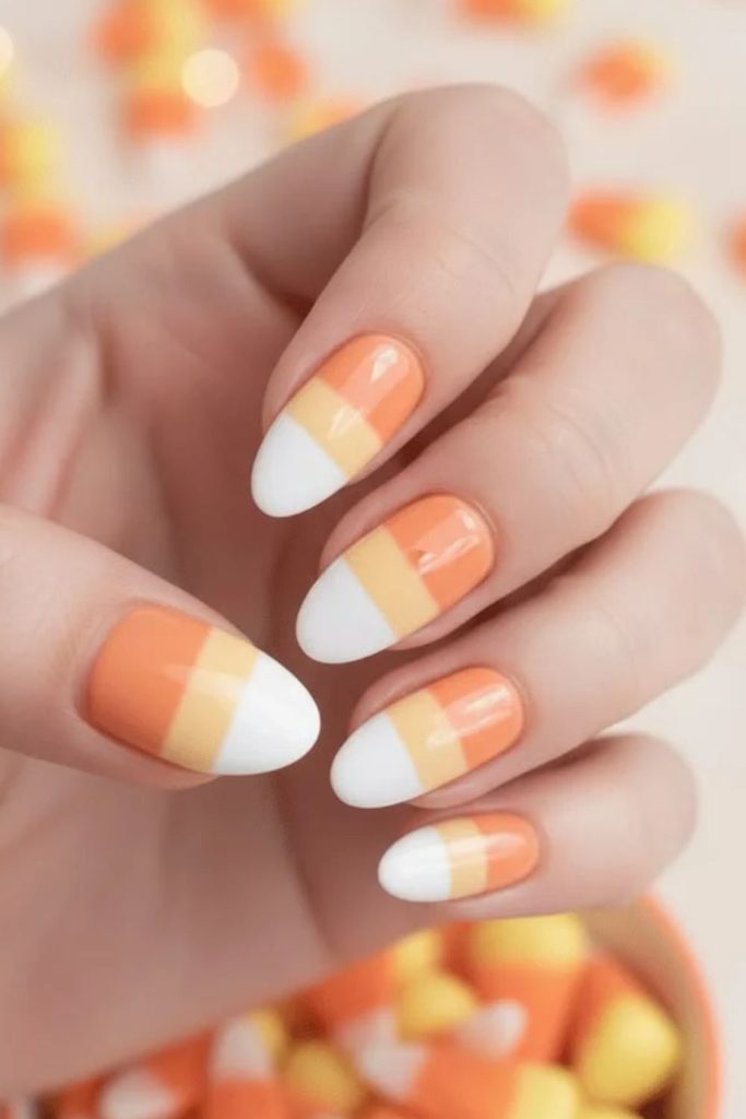 Pastel yellow peach and ivory candy corn nails.