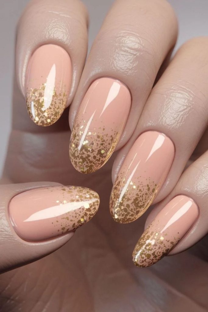 Peach disco nails with delicate holographic accents.