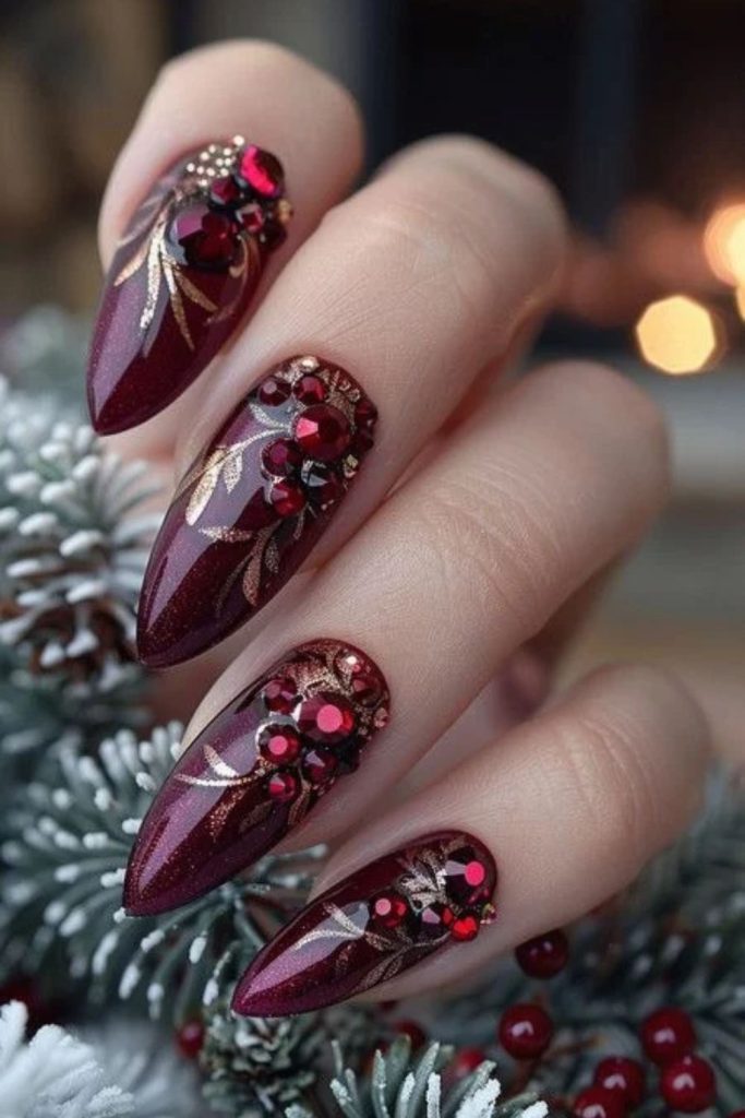 Poinsettia nail art decorated with sparkling rhinestones.