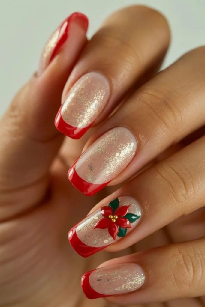 Red French tips with delicate poinsettia floral art.