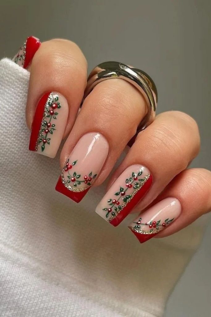 Reverse French manicure with tiny poinsettia blossoms.