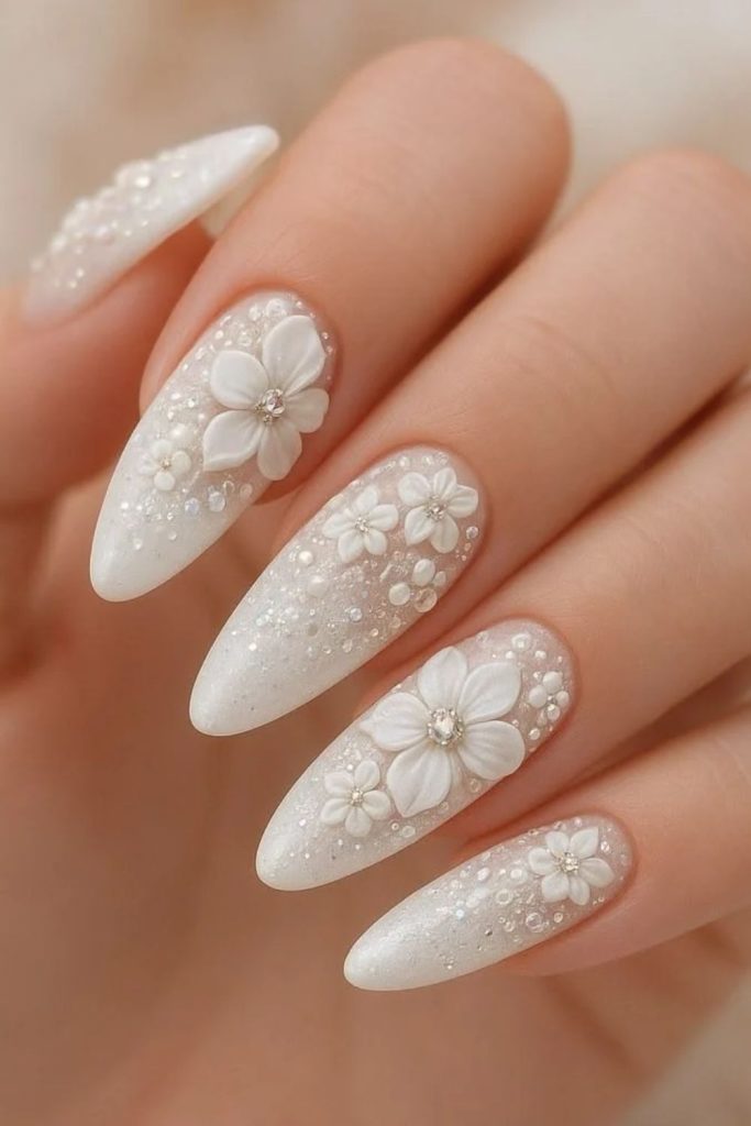 White poinsettia flowers with shimmering silver details.