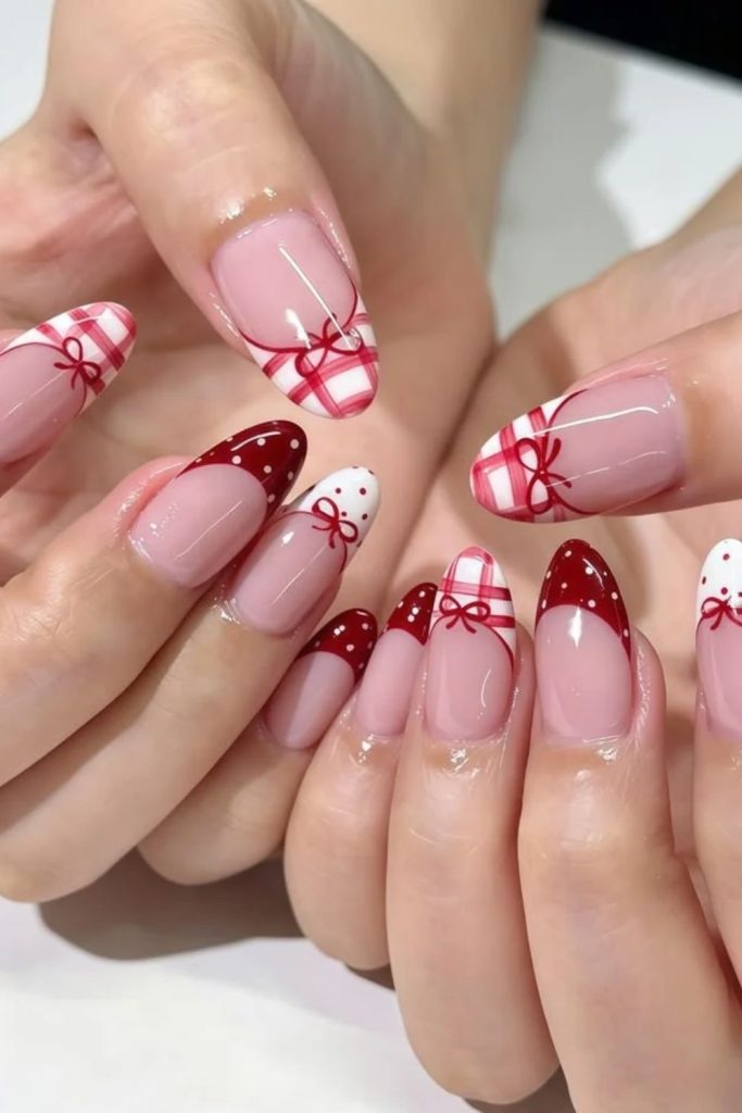 Strawberry coquette nails with miniature ribbon details.