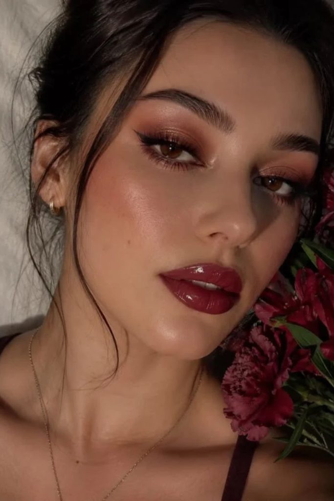Ultra glossy cherry cola glam makeup.