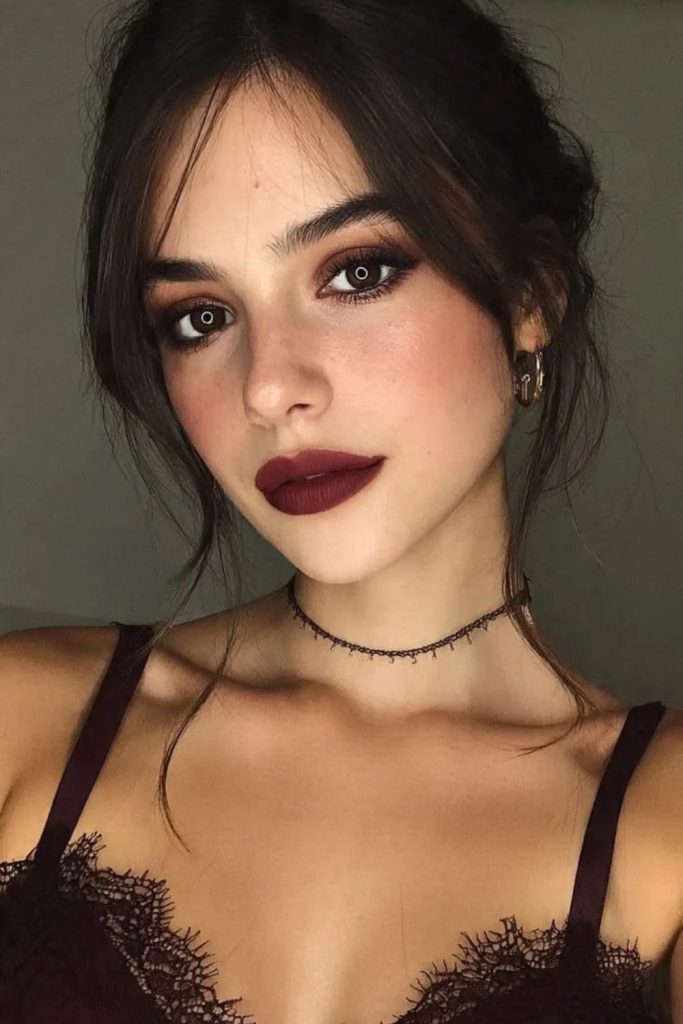 Vampy dark cherry lipstick with elegance.