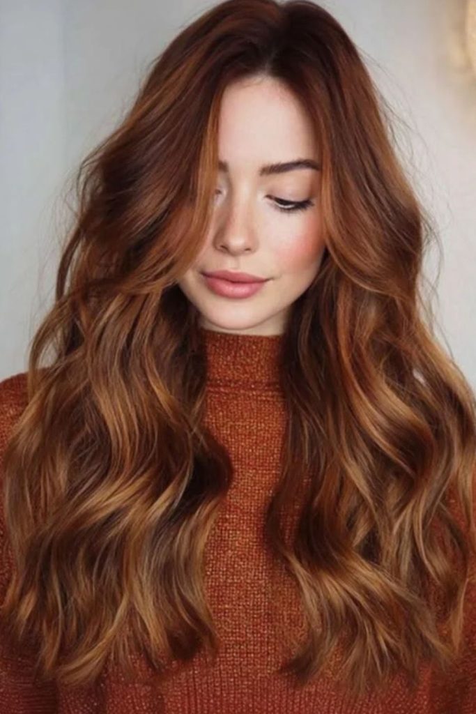Warm hazelnut copper hair with fiery reflections.