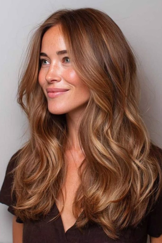 Warm toffee balayage with golden ribbons.