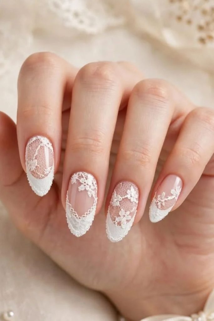 White lace coquette nails with delicate patterns.